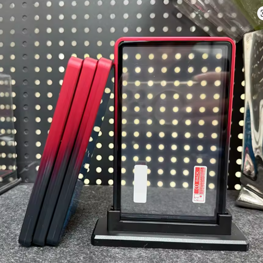 Red and black rectangular objects on a stand with a pegboard background