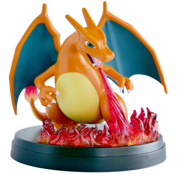 Dragon-like creature figurine with orange body, blue wings, and red flames on a white background
