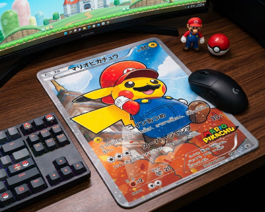 Mario Pikachu Pokémon trading card style mouse pad with black gaming mouse beside RGB keyboard and Mario collectibles on a modern gaming desk