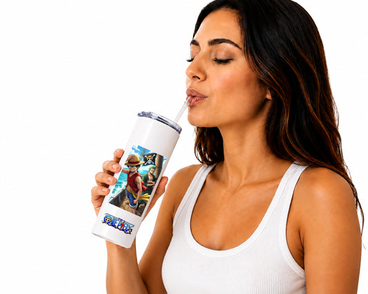 A woman with dark hair wearing a white ribbed tank top is shown from the side, drinking from a white insulated tumbler with a clear straw. The tumbler features a colorful graphic print of characters from The Legend of Zelda, including Zelda, Ganond, and the title 'LEGEND ZELDA', against a plain white background.