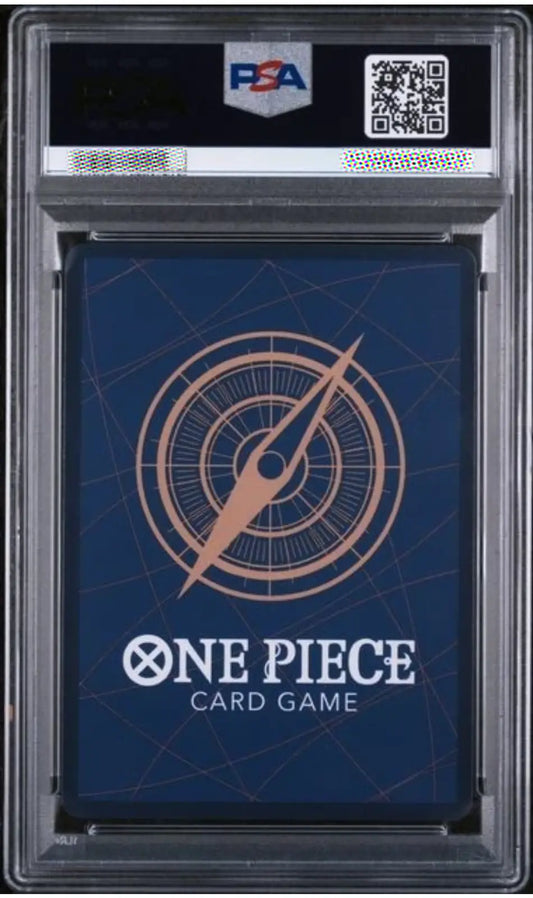 PSA graded One Piece Card Game deck box inside a clear PSA slab, showing a dark blue box with a compass design and white One Piece branding.