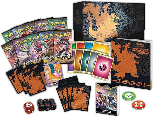 Pokémon trading card game set with cards, dice, and player's guide on a white background