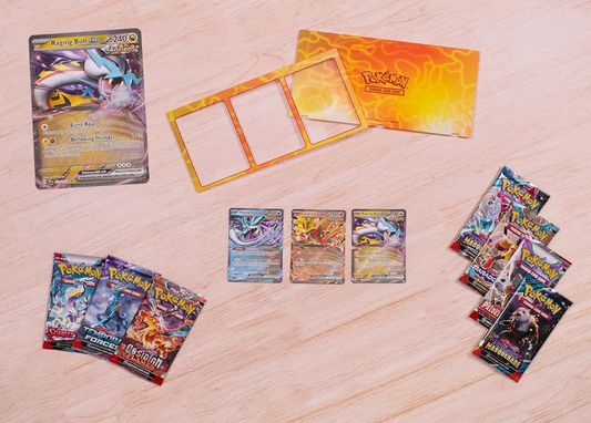 Collection of Pokémon trading cards on a wooden surface
