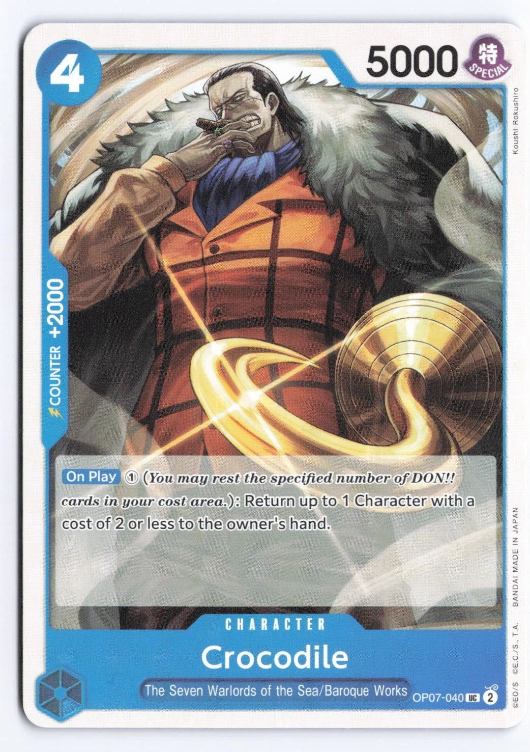 One Piece TCG character card OP07-040 featuring Crocodile in an orange plaid suit and fur-collared coat, wielding a golden hook against a sand-swirl background.