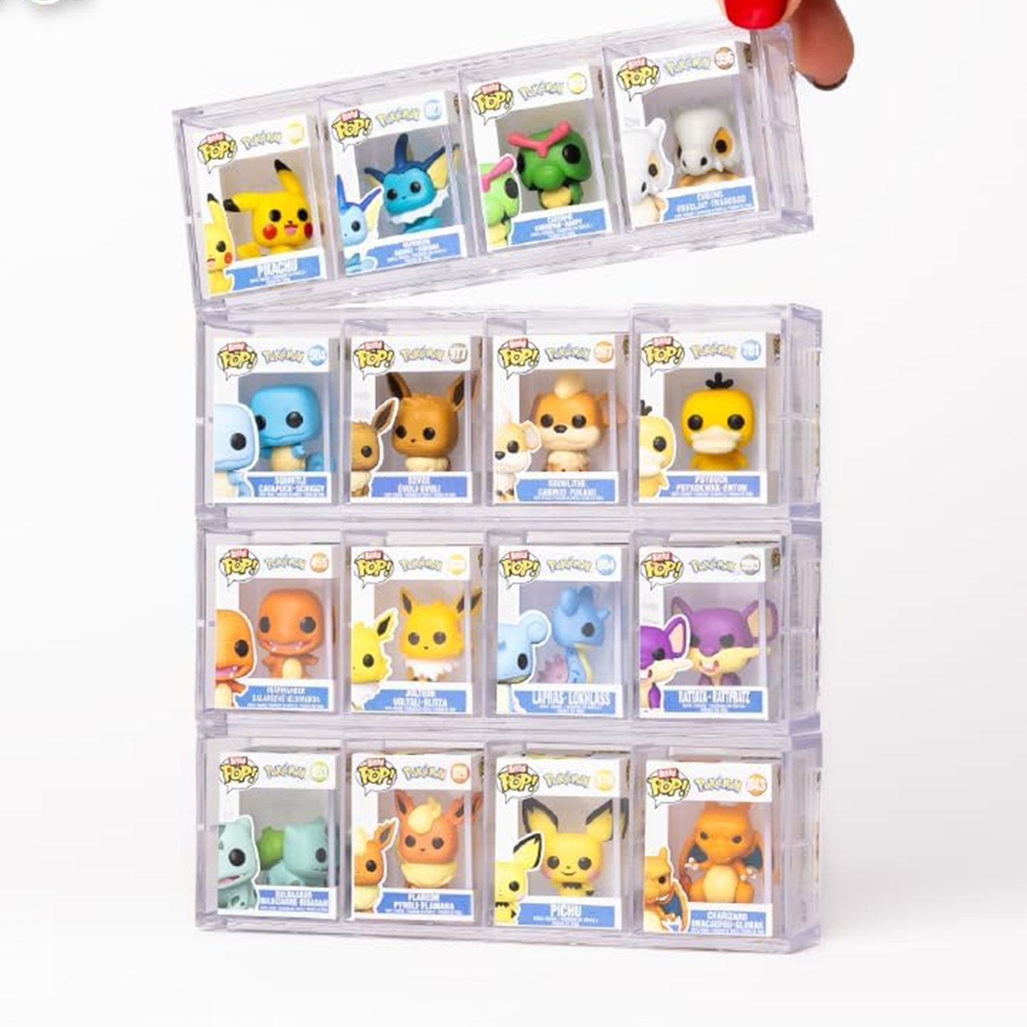 Collection of small figurines in clear display cases on a white background