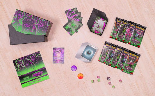 Collection of trading cards and accessories on a wooden surface