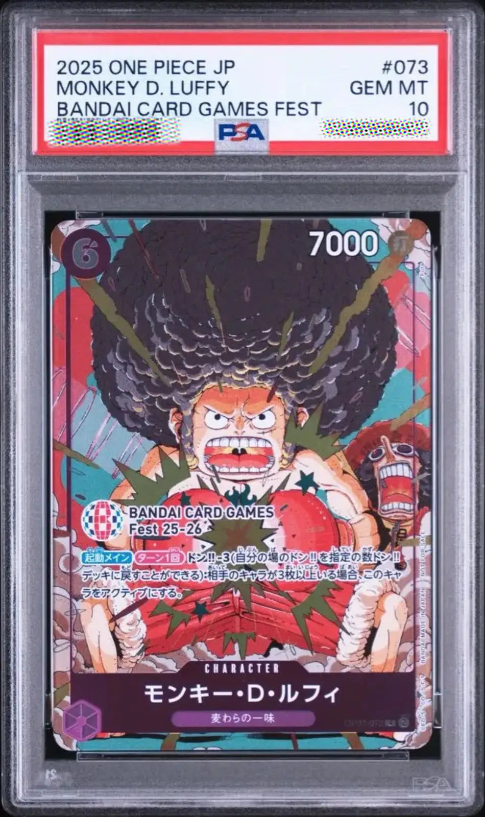 A graded One Piece JP character card in a clear PSA slab. The card is for Monkey D.
