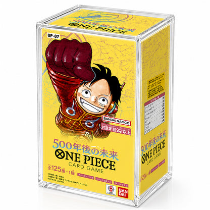 A clear acrylic display box containing a yellow One Piece card game box, featuring the character Monkey D. Luffy on the front.