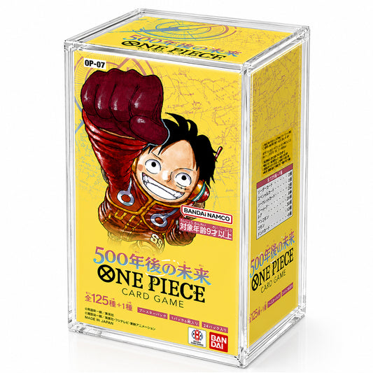 A clear acrylic display box containing a yellow One Piece card game box, featuring the character Monkey D. Luffy on the front.