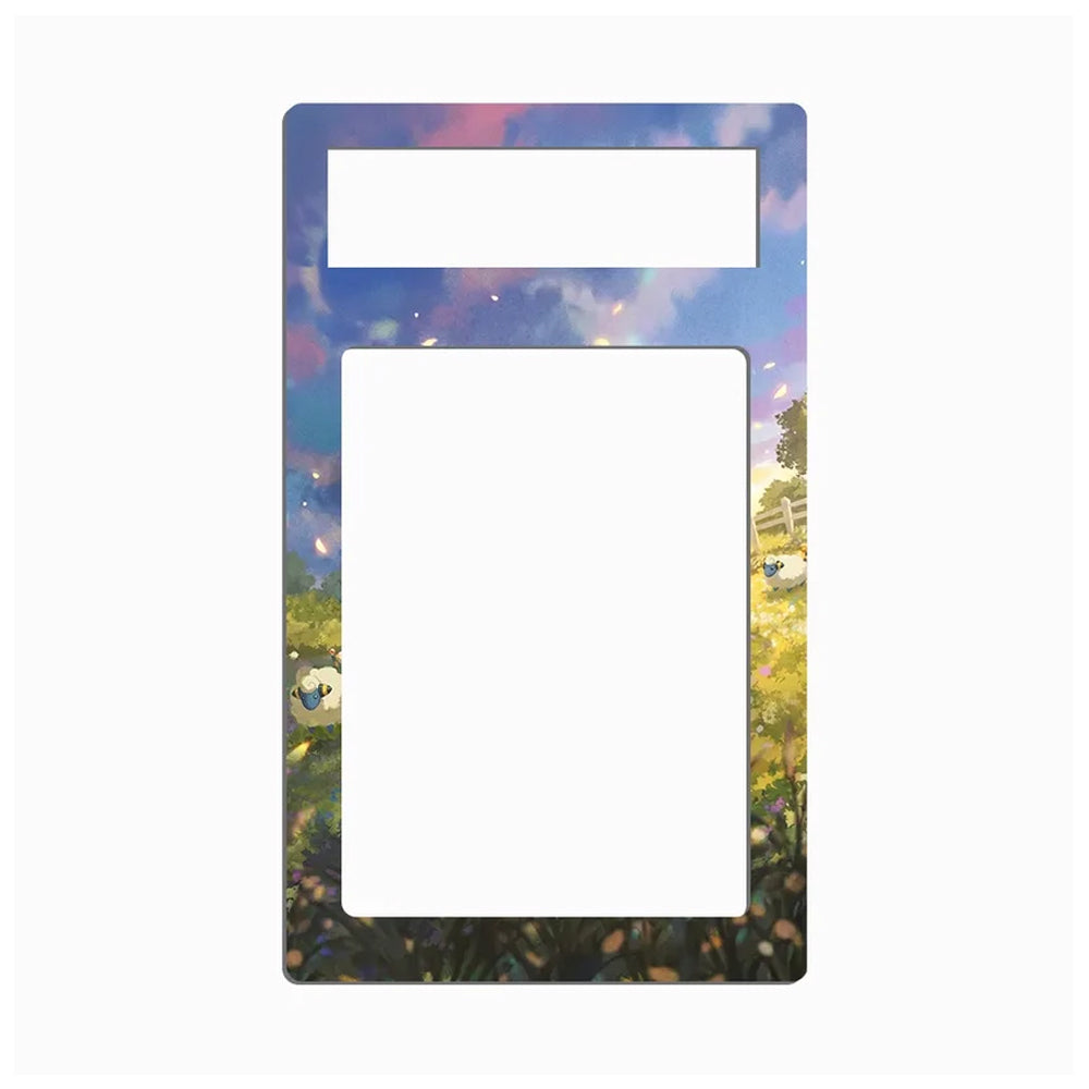 A decorative picture frame insert with a colorful landscape illustration featuring a blue sky, green trees, and a yellow field, shown on a plain white background.