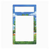 A rectangular decorative frame or magnet with rounded corners, featuring a colorful landscape border of green grass, red apples, and a blue sky with white clouds, with two blank white cutout areas at the top and center.