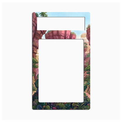 A decorative picture frame with a colorful illustrated border depicting a canyon landscape, shown on a plain white background.