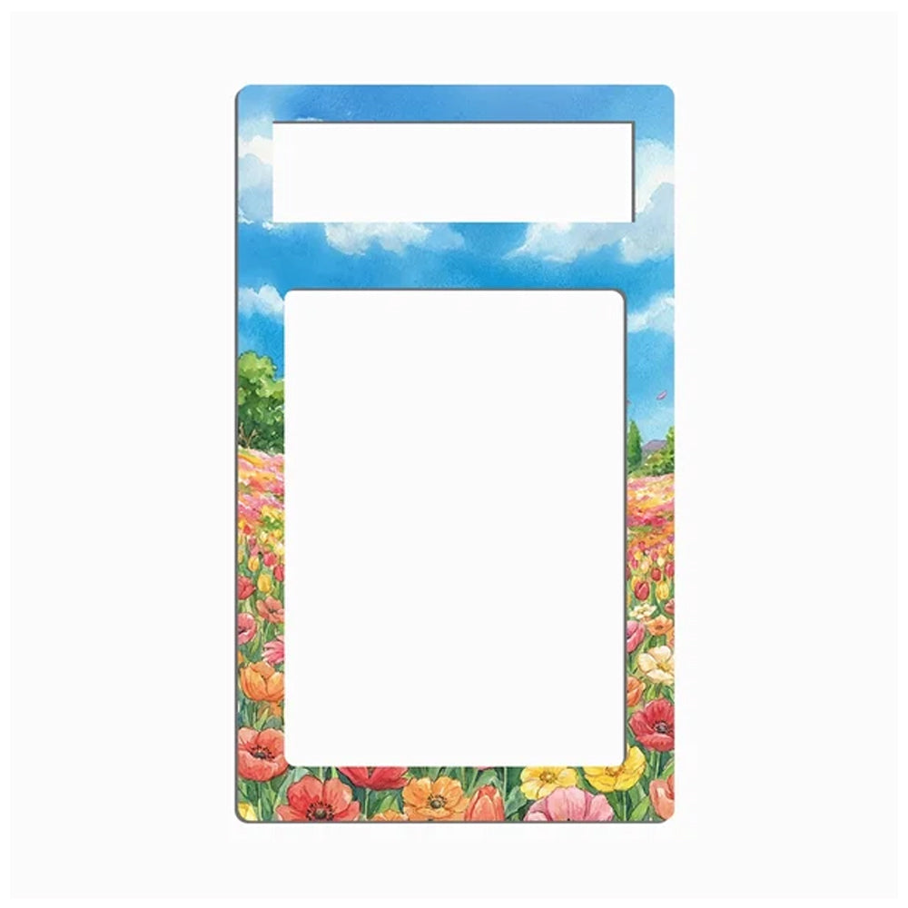 A rectangular picture frame with a colorful border depicting a blue sky with clouds and a field of pink, red, orange, and yellow flowers, shown on a plain white background.
