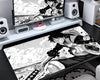 Black and white Luffy anime gaming mouse pad featuring detailed manga-style artwork, high-contrast illustrations, and an extended desk mat design by PokeTCG.