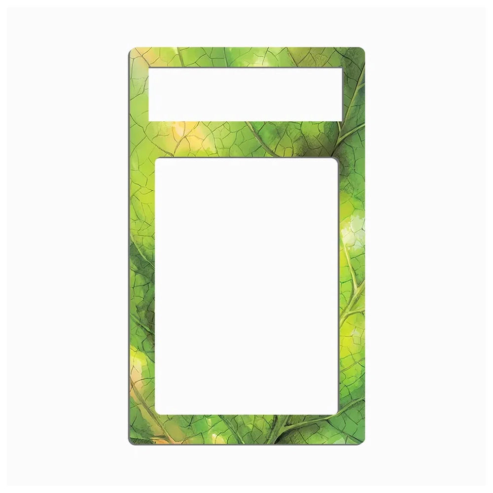 A rectangular decorative frame or insert with rounded corners, featuring a green leaf pattern border and a large blank white center cutout, shown on a plain light gray background.
