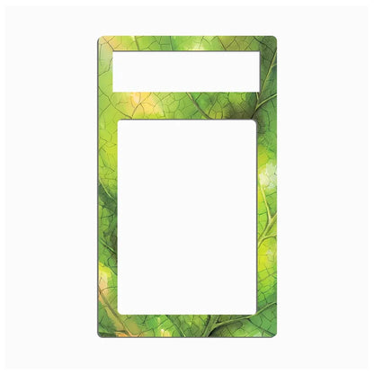 A rectangular decorative frame or insert with rounded corners, featuring a green leaf pattern border and a large blank white center cutout, shown on a plain light gray background.
