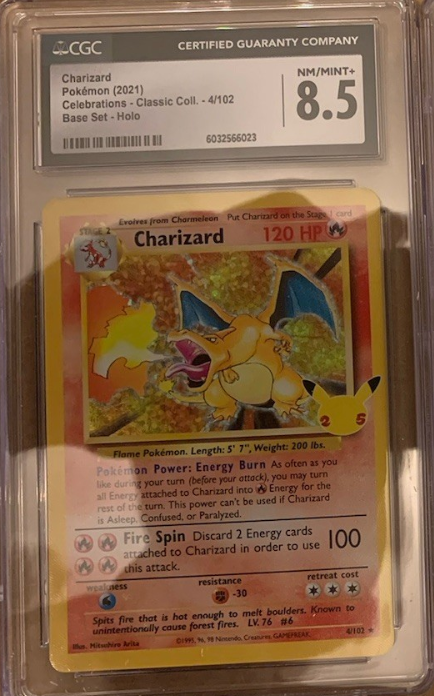 Charizard Pokémon trading card graded 8.5 by CGC in a protective case.