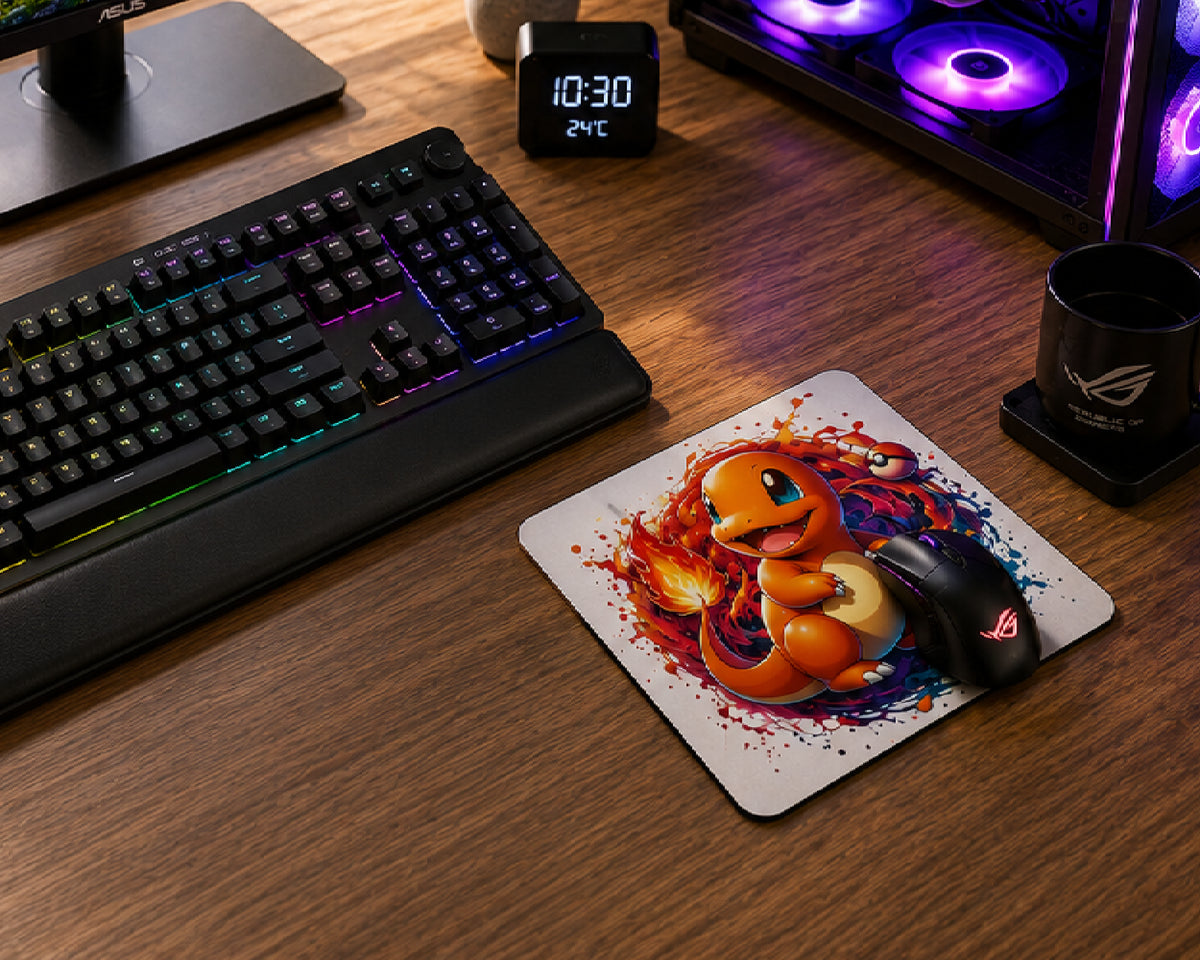 A large rectangular gaming mousepad with a colorful Yu-Gi-Oh! anime character print, shown on a wooden desk with a black gaming mouse resting on it. Surrounding the mousepad are a keyboard, monitor, PC tower with RGB lighting, and headphones.