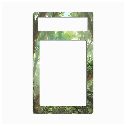 A rectangular decorative plate or frame with rounded corners, featuring an illustrated forest scene in green and brown tones around a large white center cutout and a smaller white top cutout, shown on a plain light gray background.