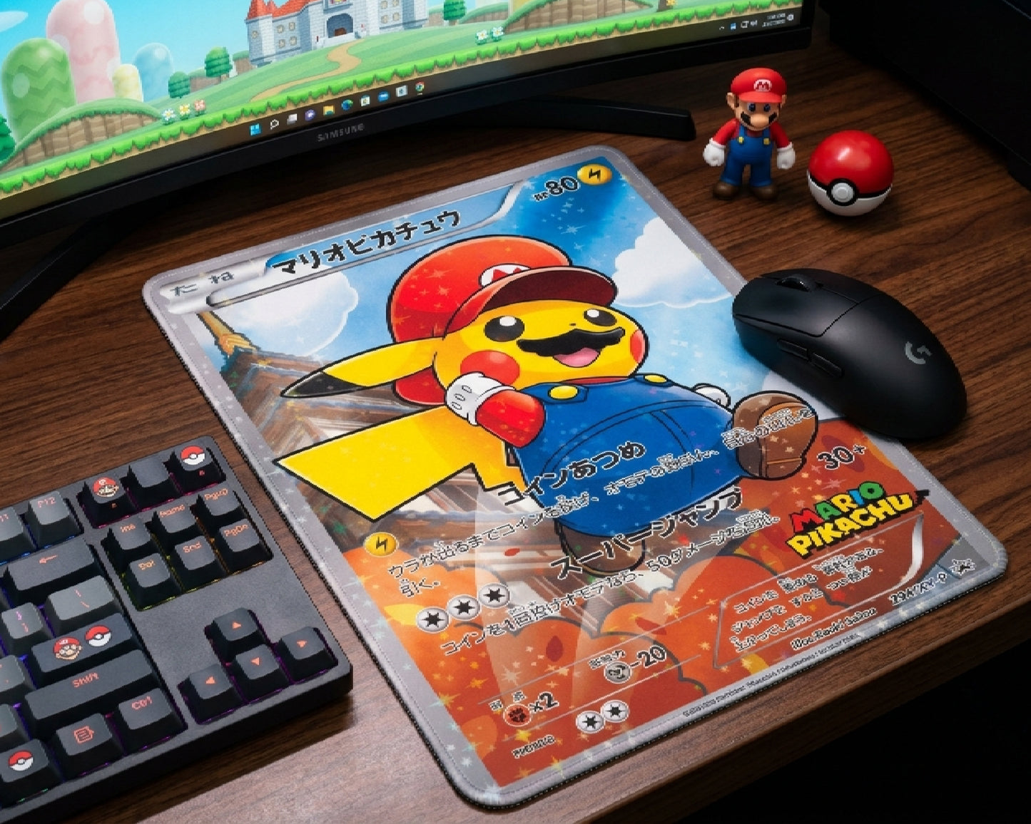 Mario Pikachu Pokémon trading card style mouse pad with black gaming mouse beside RGB keyboard and Mario collectibles on a modern gaming desk