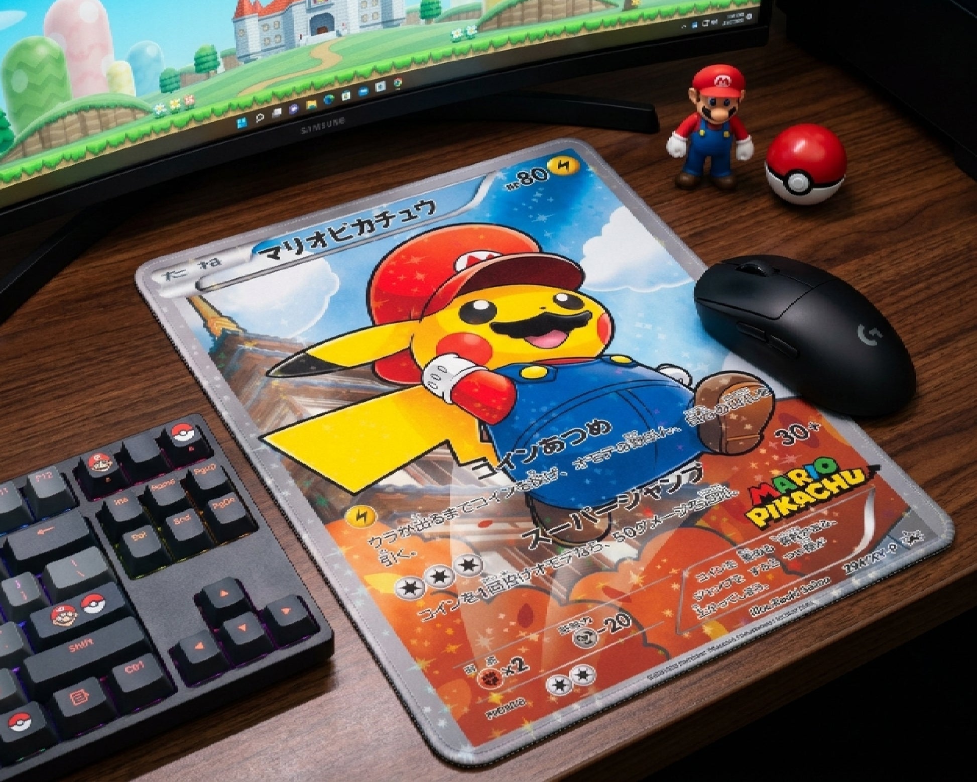 Mario Pikachu Pokémon trading card style mouse pad with black gaming mouse beside RGB keyboard and Mario collectibles on a modern gaming desk