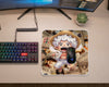 Cute chibi Gear 5 Monkey D. Luffy anime mouse pad with wanted poster collage background, placed beside RGB gaming mouse and mechanical keyboard on minimalist desk setup