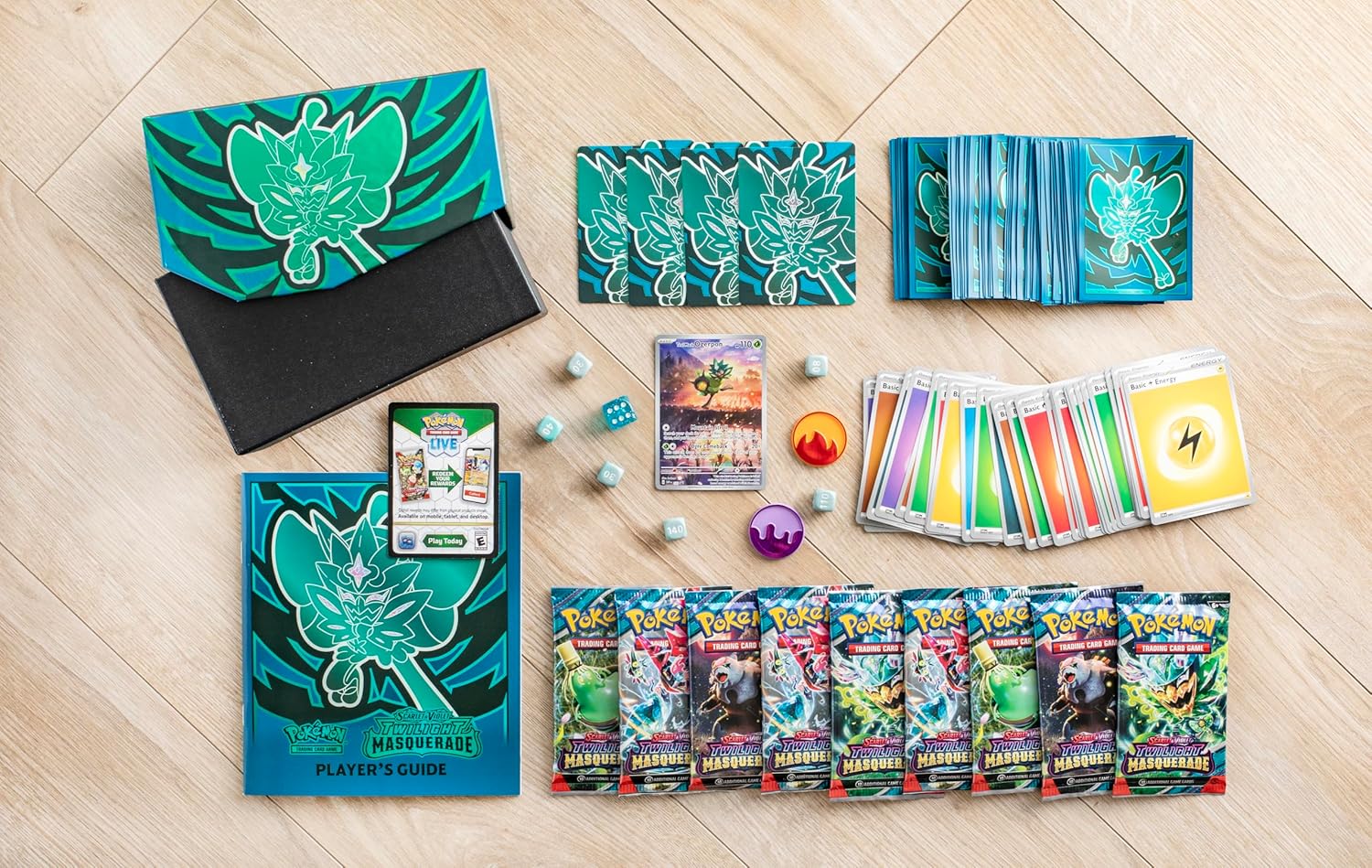 Collection of trading cards and accessories on a wooden floor