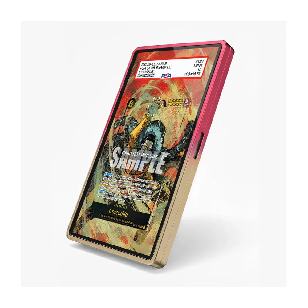 A smartphone case shown at an angle on a light gray background. The case has a metallic gold frame with a vibrant pink inner bumper and a colorful fantasy card design printed on the back, complete with a PSA authentication sticker at the top.