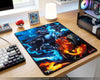 Large custom Mega Charizard X fan art gaming mouse pad with vibrant blue and orange flame effects beside RGB gaming PC and Pokémon themed desk decor