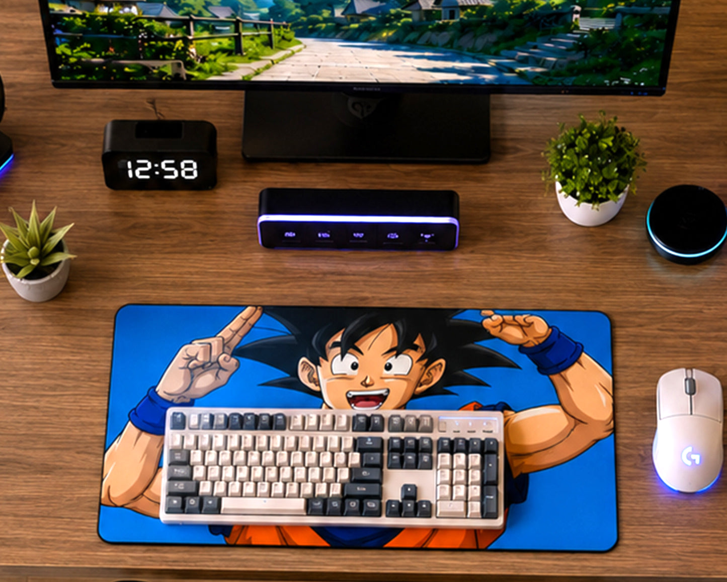 A large desk mat featuring an anime character on a blue background, styled on a wooden desk with a keyboard, mouse, computer monitor, small plants, and a digital clock.