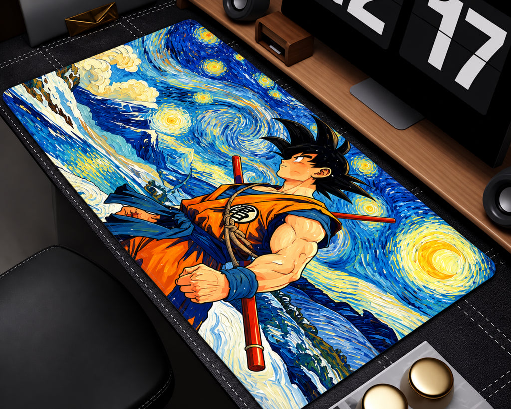 A rectangular desk mat featuring an anime character in an orange and blue outfit against a swirling blue and yellow Starry Night-inspired background, styled on a desk with a monitor, speakers, and other office accessories.