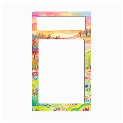 A rectangular picture frame with a colorful landscape border and a blank white center, shown on a light gray background.