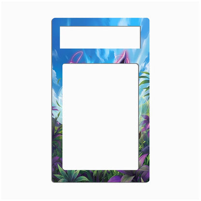 A decorative rectangular frame or plate with rounded corners, featuring a colorful illustrated border of blue sky, white clouds, and purple and green foliage. The center and top sections are blank white spaces, likely for printing or display.