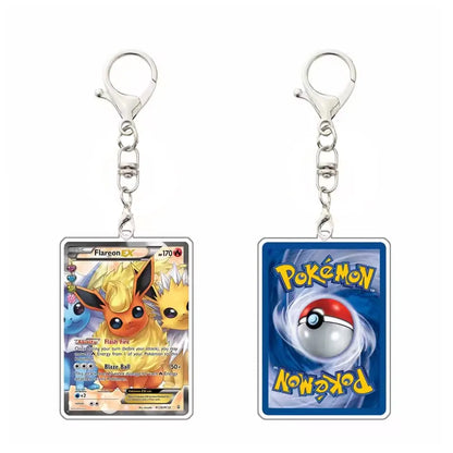 Two Pokémon-themed acrylic keychains shown side by side on a white background. The left keychain features Flareon EX artwork with a silver clasp, and the right keychain shows the blue Pokémon ball design with the Pokémon logo.