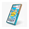 A slim rectangular tablet or e-reader device shown at an angle on a light gray background. The screen displays a colorful Pokémon trading card mockup, and the device has a metallic teal-blue front edge with a light wood-toned top frame.