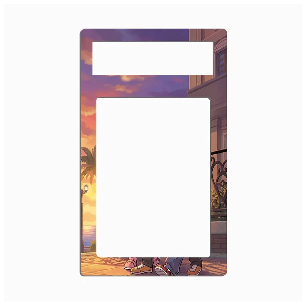 A rectangular decorative plate or frame with rounded corners, featuring an illustrated sunset scene with palm trees, a balcony, and a couple's feet at the bottom. The center and top cutout areas are blank white spaces, shown on a plain light gray background.