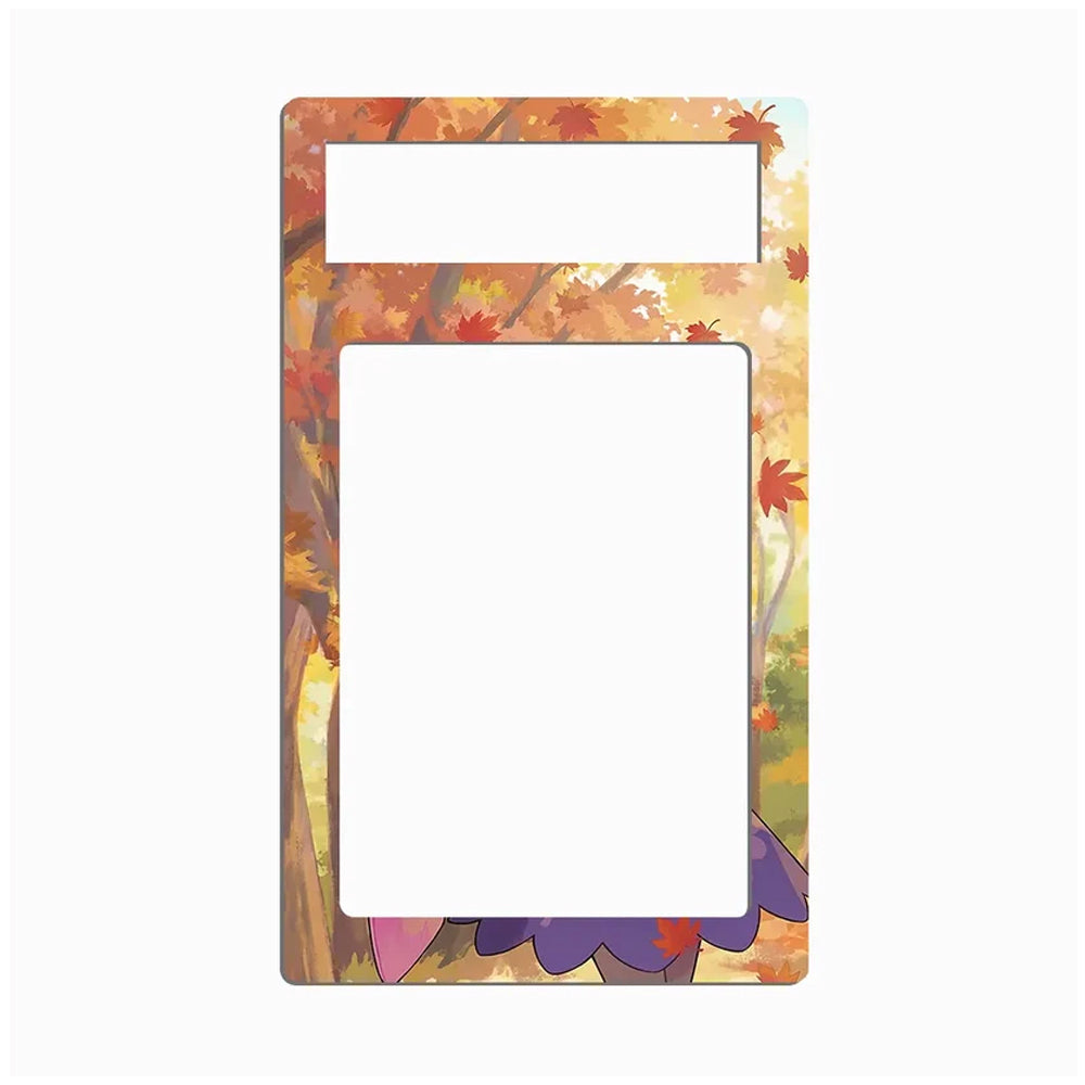 A rectangular decorative frame or magnet with rounded corners, featuring an autumn forest design with orange, yellow, and red leaves around the border, with two blank white rectangular cutouts near the top and center.