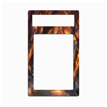 A rectangular decorative plate or frame with a large central cutout and a smaller horizontal cutout near the top, featuring an abstract fiery pattern in orange, brown, and black around the border on a light gray background.