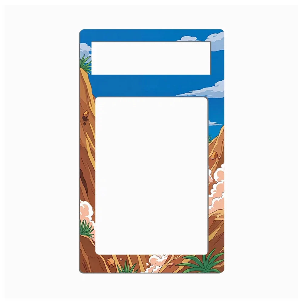 A rectangular picture frame with a desert canyon landscape border, featuring blue sky, brown rock cliffs, and small green plants, shown on a plain white background.