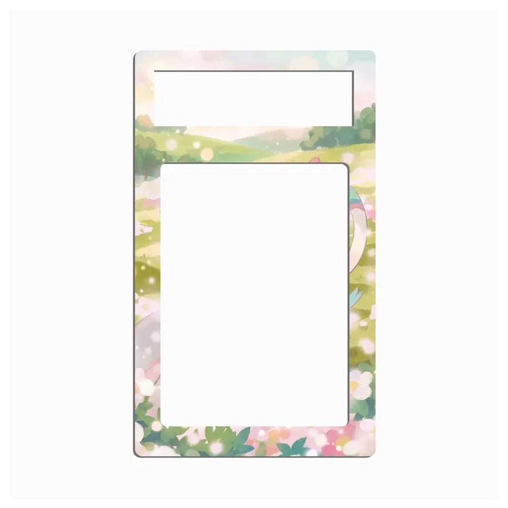 A decorative rectangular frame or mat with rounded corners, featuring a pastel landscape border and floral accents around the edges, with a large blank white center and a smaller blank white top section.