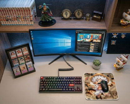 Modern One Piece anime gaming setup featuring Gear 5 Luffy themed mouse pad, RGB mechanical keyboard, ultrawide monitor, manga collectibles, and clean desktop workspace aesthetic
