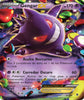 A Pokémon trading card featuring GengarEX, a purple ghost-type Pokémon with red eyes, shown against a colorful background of shiny berries. The card has Spanish text and a purple health bar at the bottom.