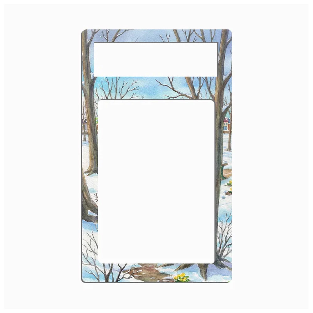 A rectangular metal plate with a single cutout, featuring a winter landscape illustration of bare trees in snow under a light blue sky.
