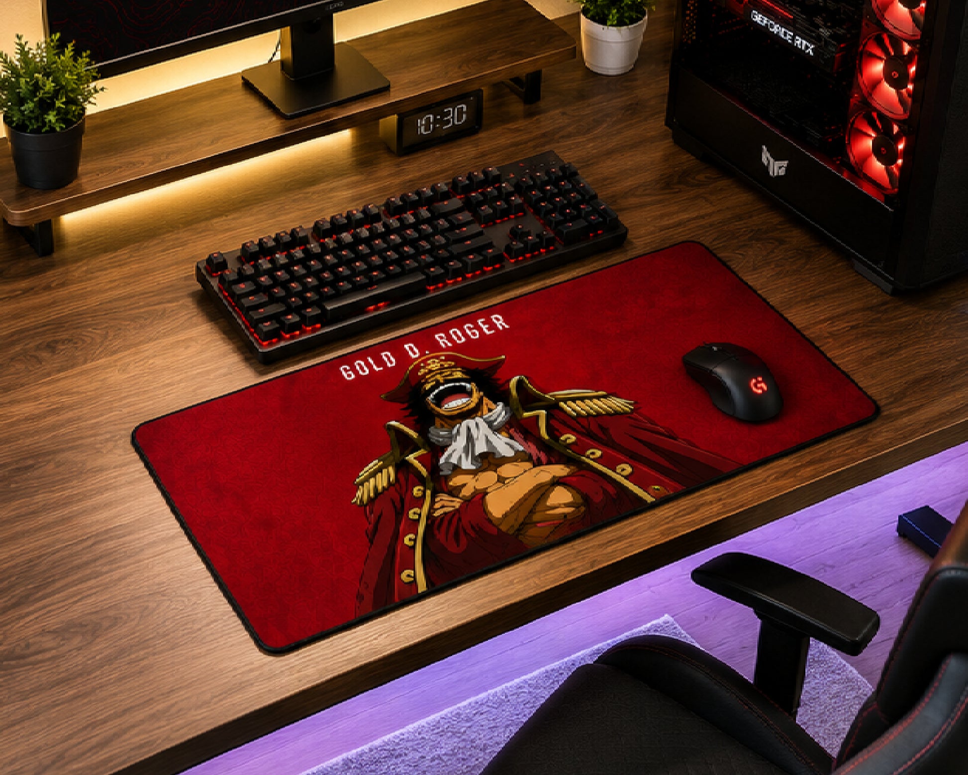 A large red desk mat featuring a detailed illustration of Gold Roger from One Piece, styled on a wooden desk alongside a keyboard, mouse, and computer tower.