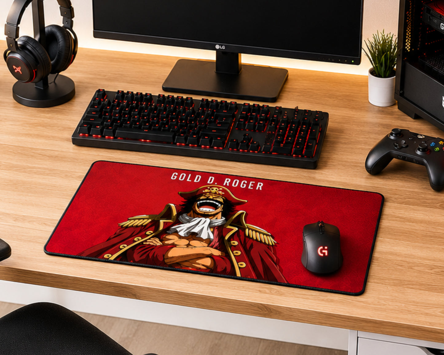 A large gaming desk mat featuring an anime-style illustration of Gold Roger from One Piece on a red background, styled on a wooden desk alongside a keyboard, mouse, headphones, and controller.