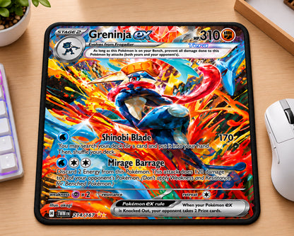 A rectangular desk mat featuring the Greninja EX card artwork from Pokémon, placed on a wooden desk next to a keyboard, mouse, and small plant.