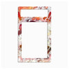 A rectangular decorative frame or mat with rounded corners, featuring a colorful abstract collage print in red, orange, pink, white, and black. The top section has a horizontal cutout, and the larger central section is a vertical cutout, leaving a solid white center area.