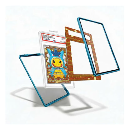 A clear acrylic Pokémon card protector case with a metallic blue frame, shown holding a graded Pokémon TCG card. The image also shows the inner brown cardboard insert and a second empty frame floating beside it on a clean white background.