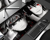 Itachi Uchiha and Naruto Uzumaki anime gaming mouse pad featuring grayscale character portraits, glowing red Sharingan eyes, black and white manga artwork, and dramatic red splatter accents.