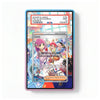 A PSA graded display card showing a Pokémon Lacey Supporter card inside a colorful holographic protective case, photographed on a plain white background.